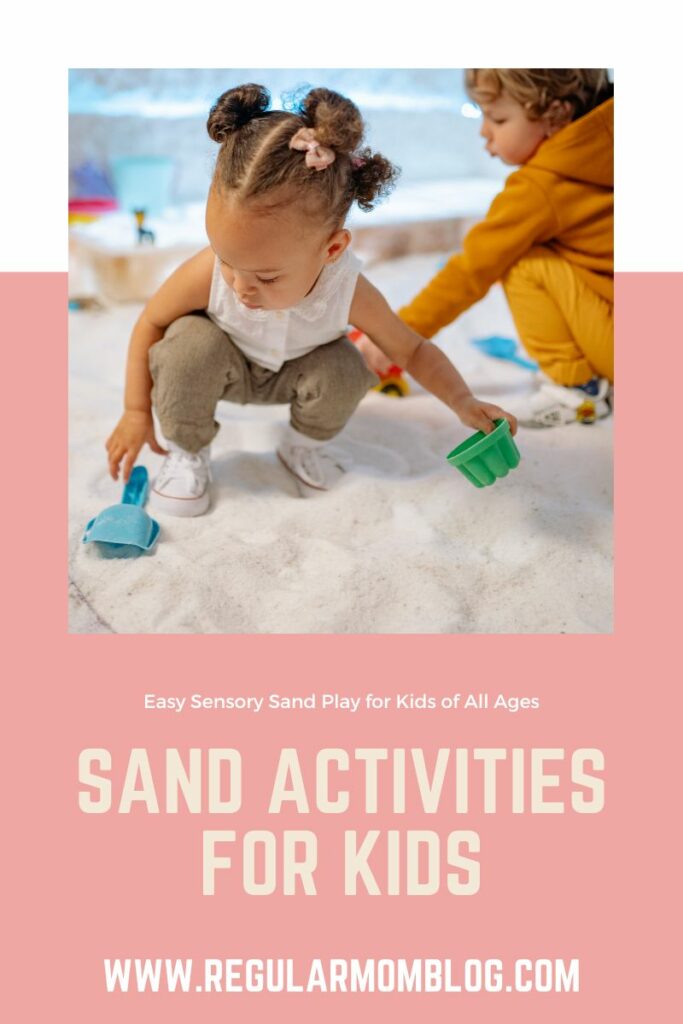 a toddler girl standing in a sand box shoveling sand for a sand activity