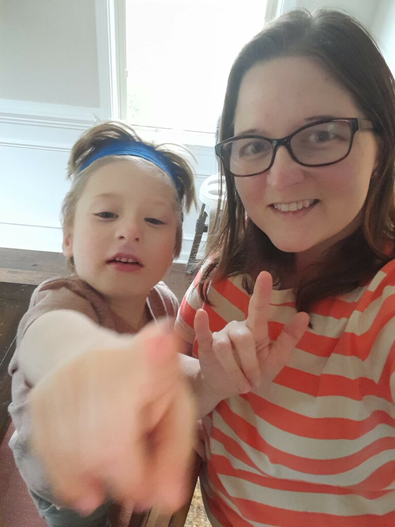 a mom and her son doing ASL sign language