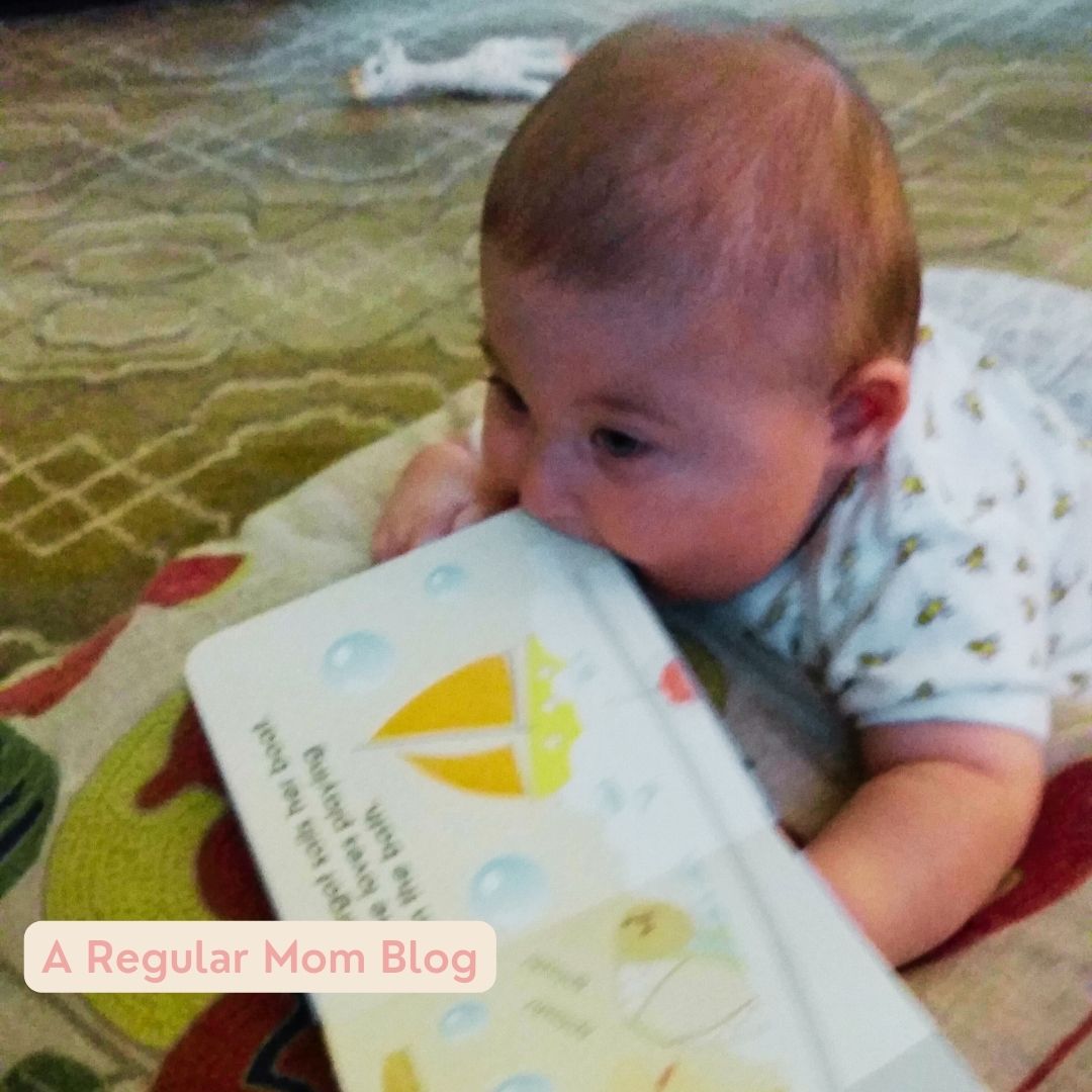 a baby exploring reading on their tummy